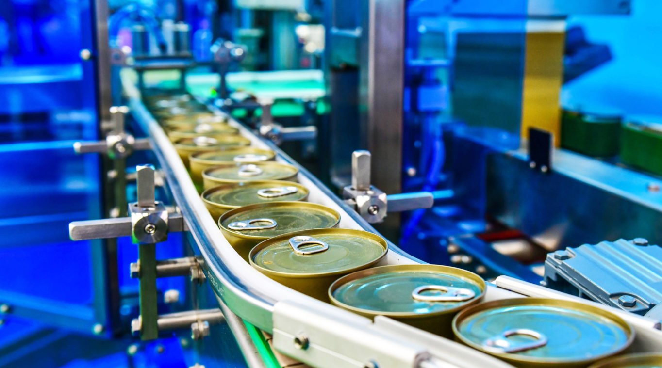 Canned,Food,Products,On,Conveyor,Belt,In,Distribution,Warehouse.parcels,Transportation
